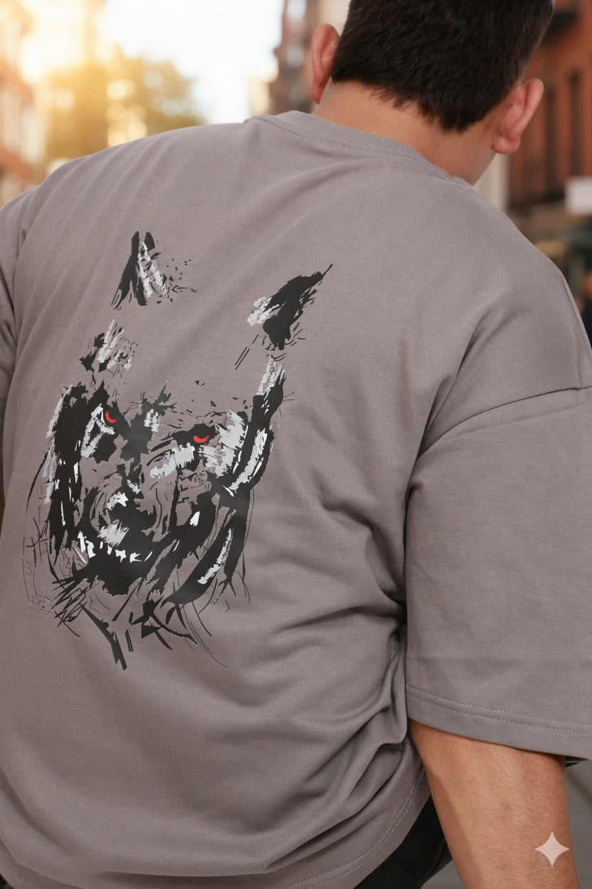 Person wearing a gray t-shirt with a black and white graphic design on the back.