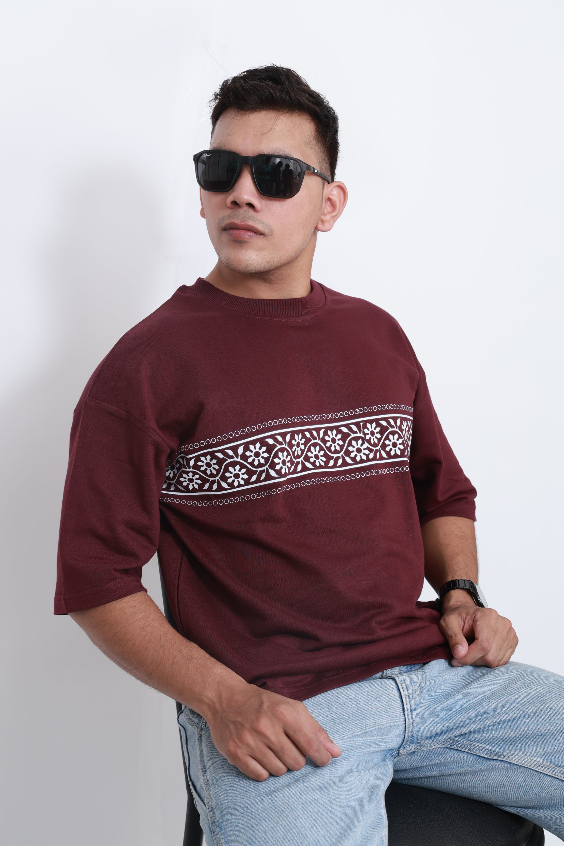 Close-up of Bandhani Boulevard maroon oversized t-shirt – premium cotton heritage bandhani pattern graphic