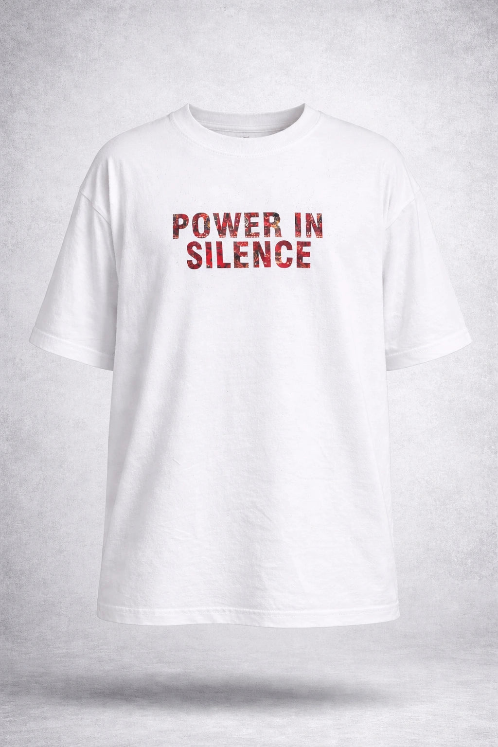 White t-shirt with 'POWER IN SILENCE' text in red on a light gray background