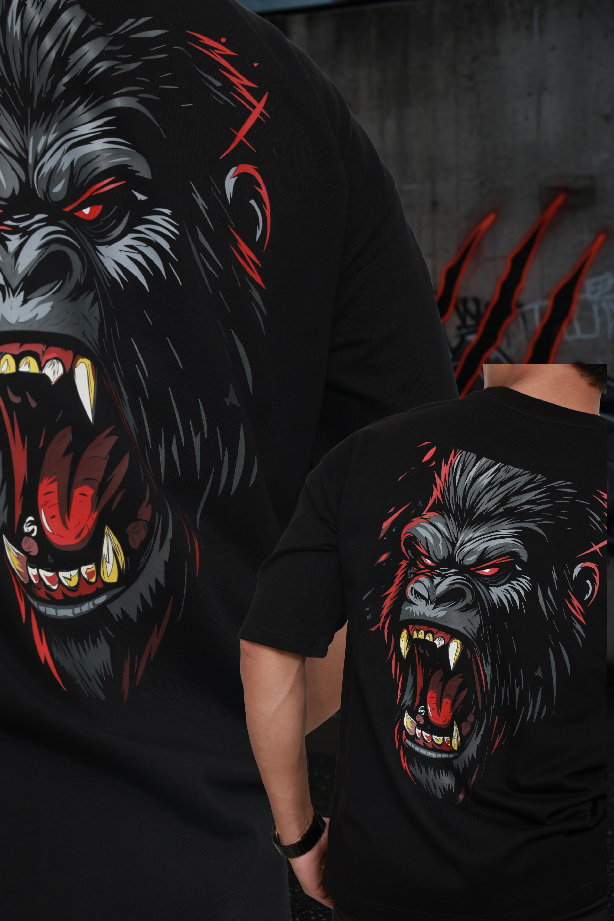 Two black t-shirts with a graphic of a gorilla with red eyes and sharp teeth on a dark background.