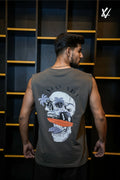 Man wearing a sleeveless shirt with a skull design on the back, standing against a dark background.