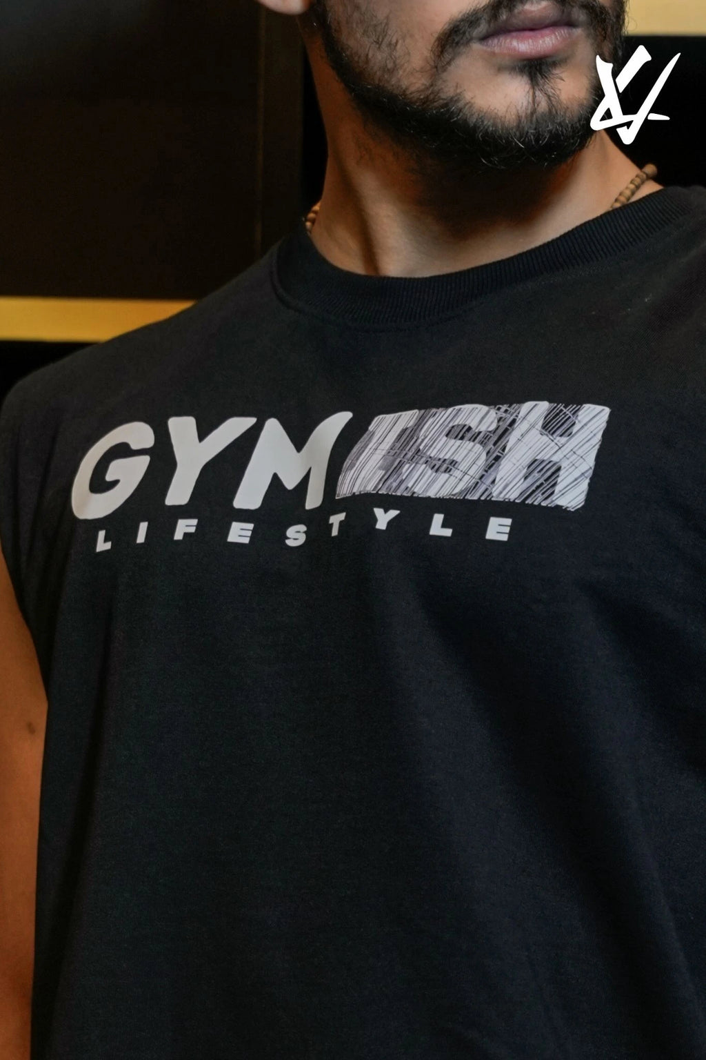 Person wearing a black t-shirt with 'GYM LIFESTYLE' text and graphic design.